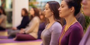 Relaxed women performing yoga